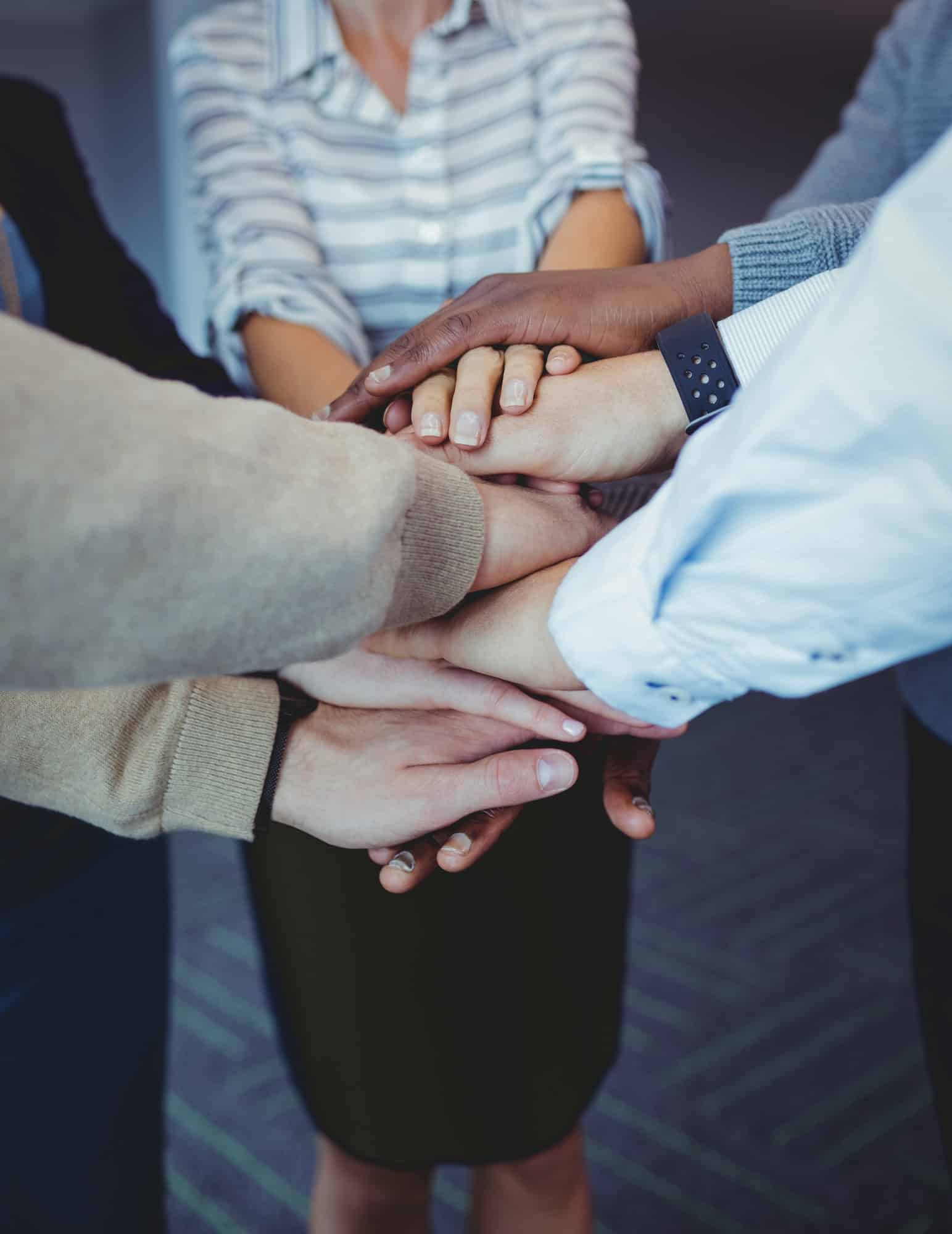 business-colleagues-stacking-hands.jpg